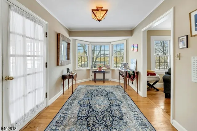 a front view of a house with a yard and glass windows