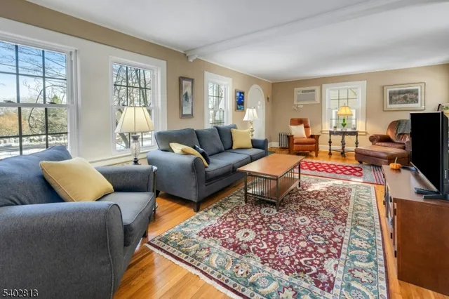 a kitchen with stainless steel appliances granite countertop a sink a stove and a wooden cabinets