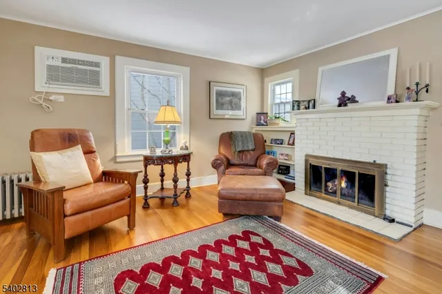 a dining room with furniture and front door