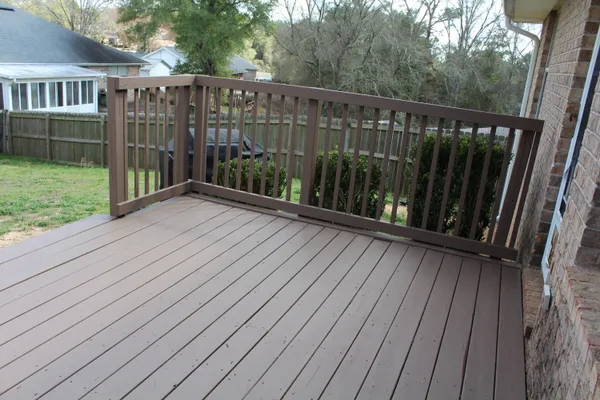 a view of balcony with wooden floor