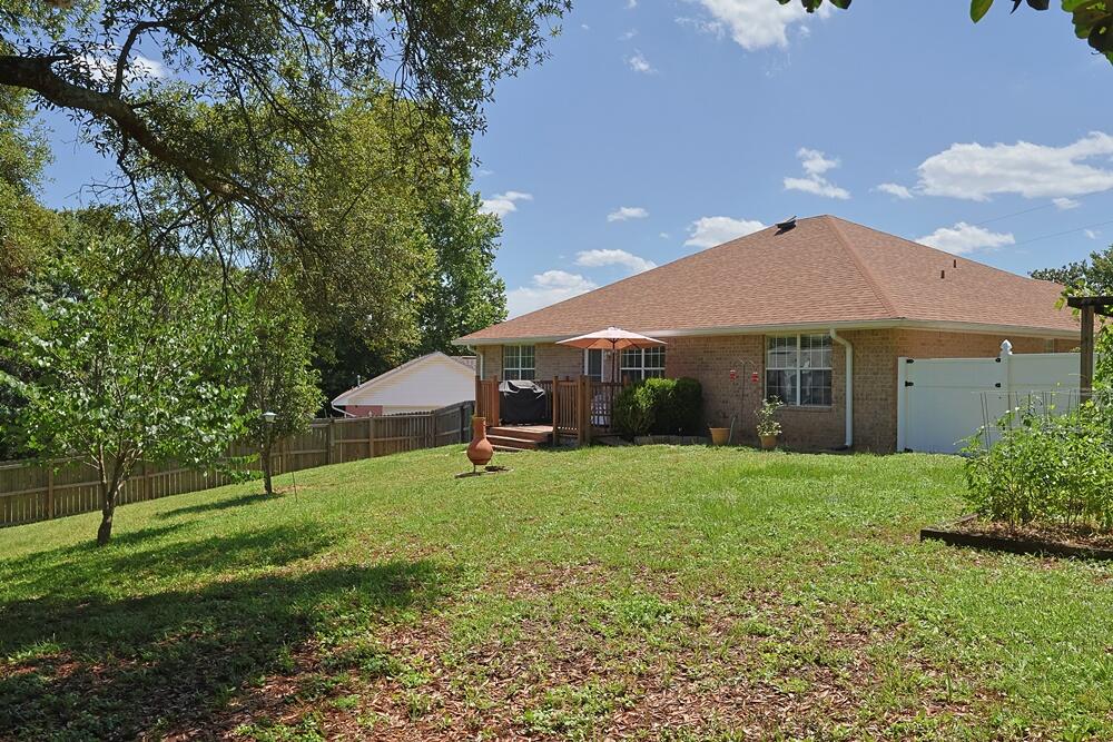 5205 Whitehurst Lane Crestview, FL 32536 - Photo 35 of 37 a view of a house with a backyard
