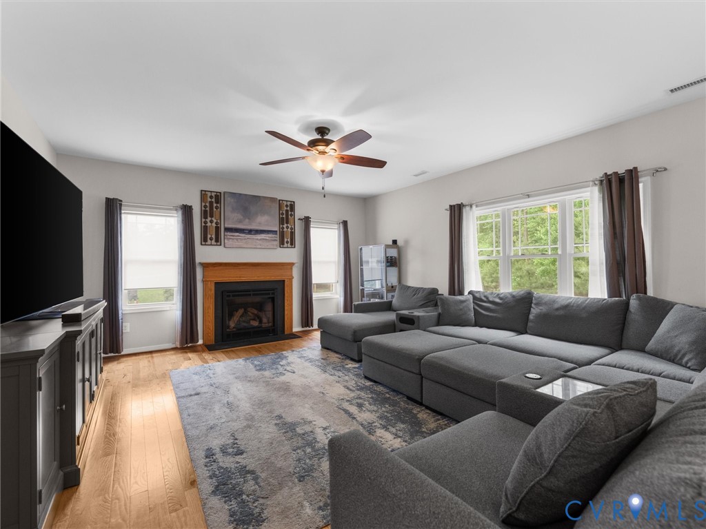 10824 Avening Road Chesterfield, VA 23832 - Photo 19 of 47 a living room with furniture a fireplace and a flat screen tv