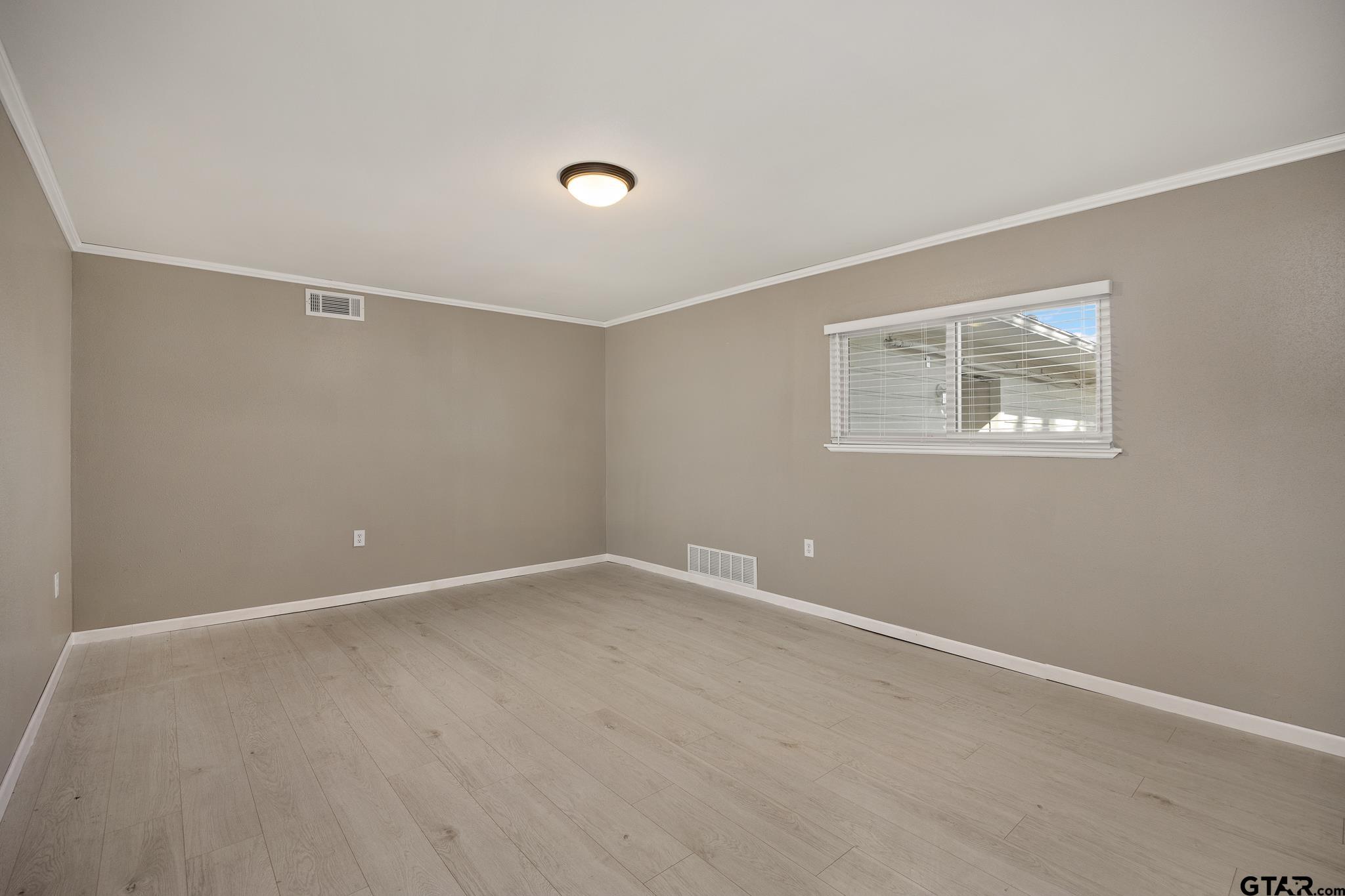 291 East Main Street Van, TX 75790 - Photo 12 of 37 an empty room with windows