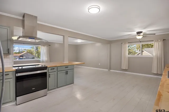 a kitchen with a stove and a sink