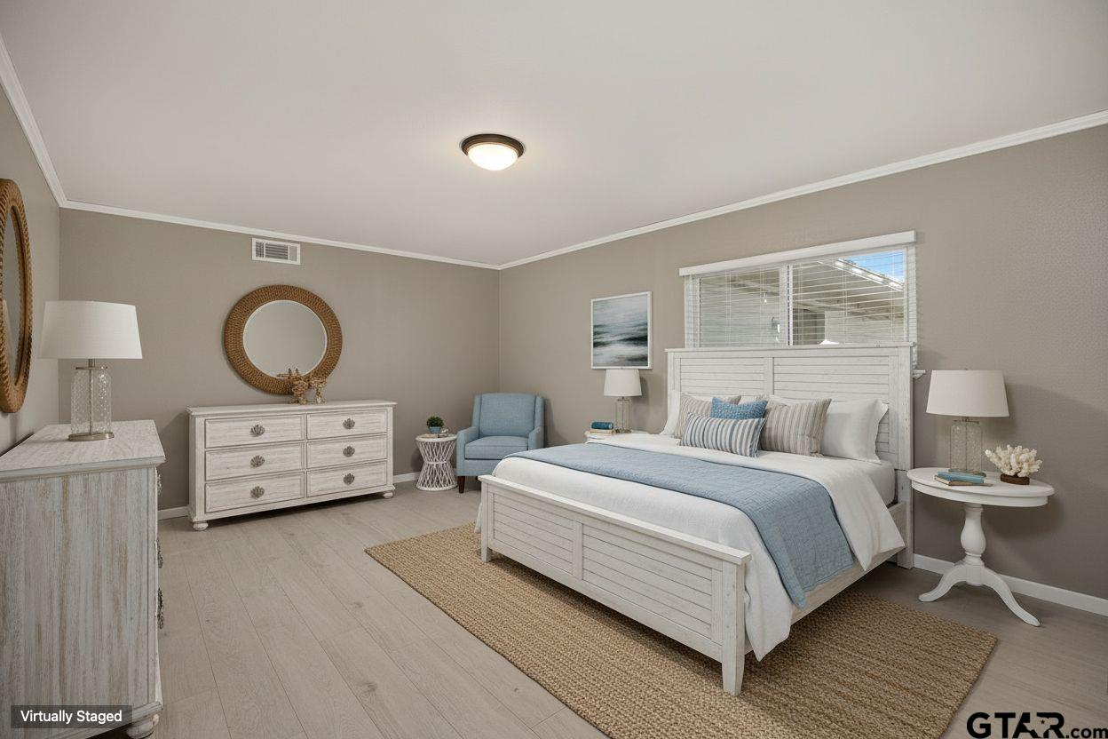 291 East Main Street Van, TX 75790 - Photo 15 of 43 a bedroom with a bed and dresser with mirror
