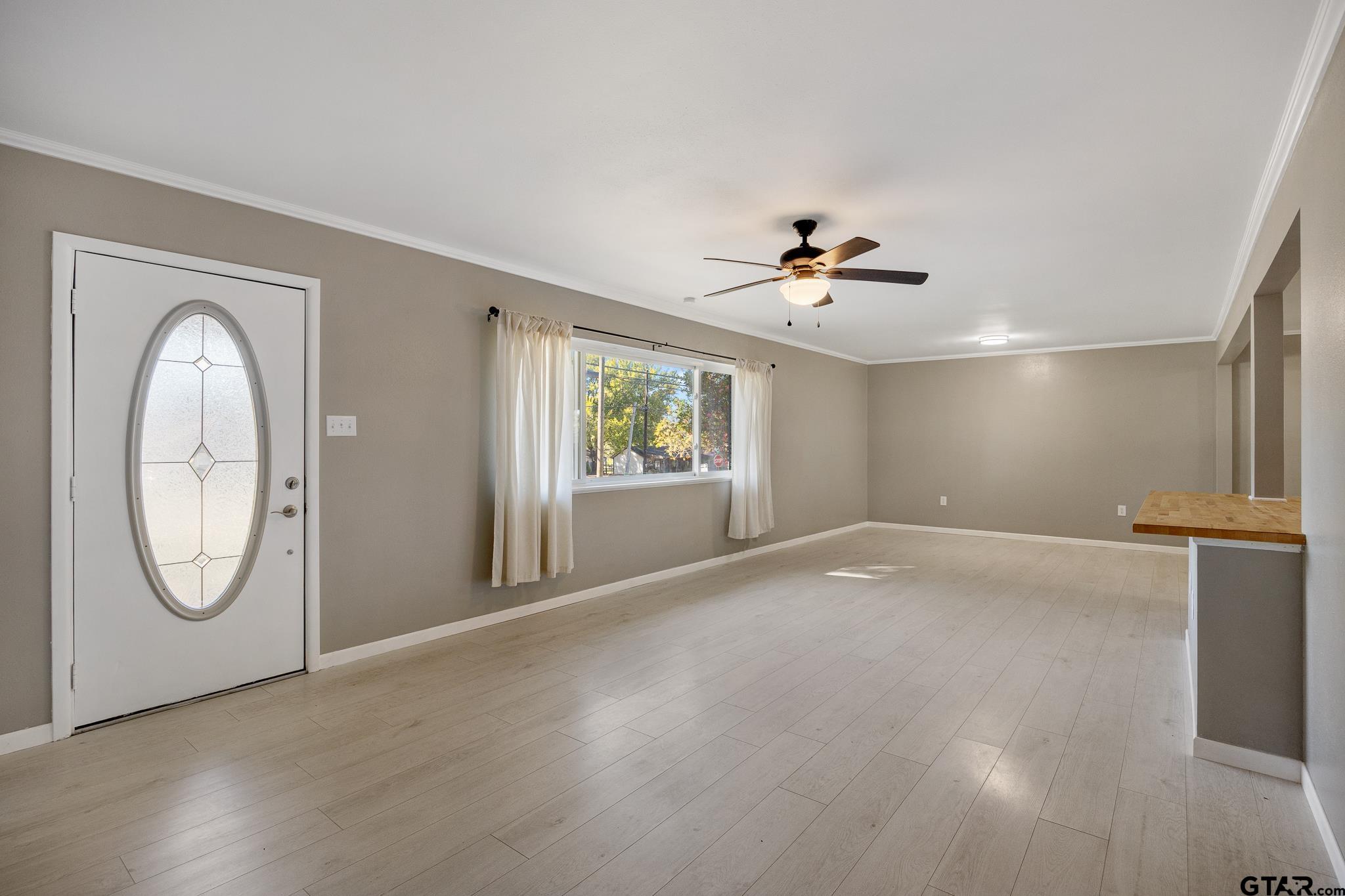 291 East Main Street Van, TX 75790 - Photo 2 of 43 an empty room with windows and fan