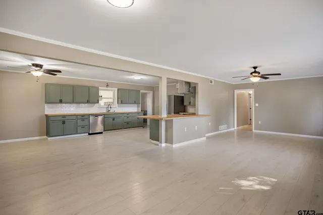 a view of a kitchen with furniture and a kitchen