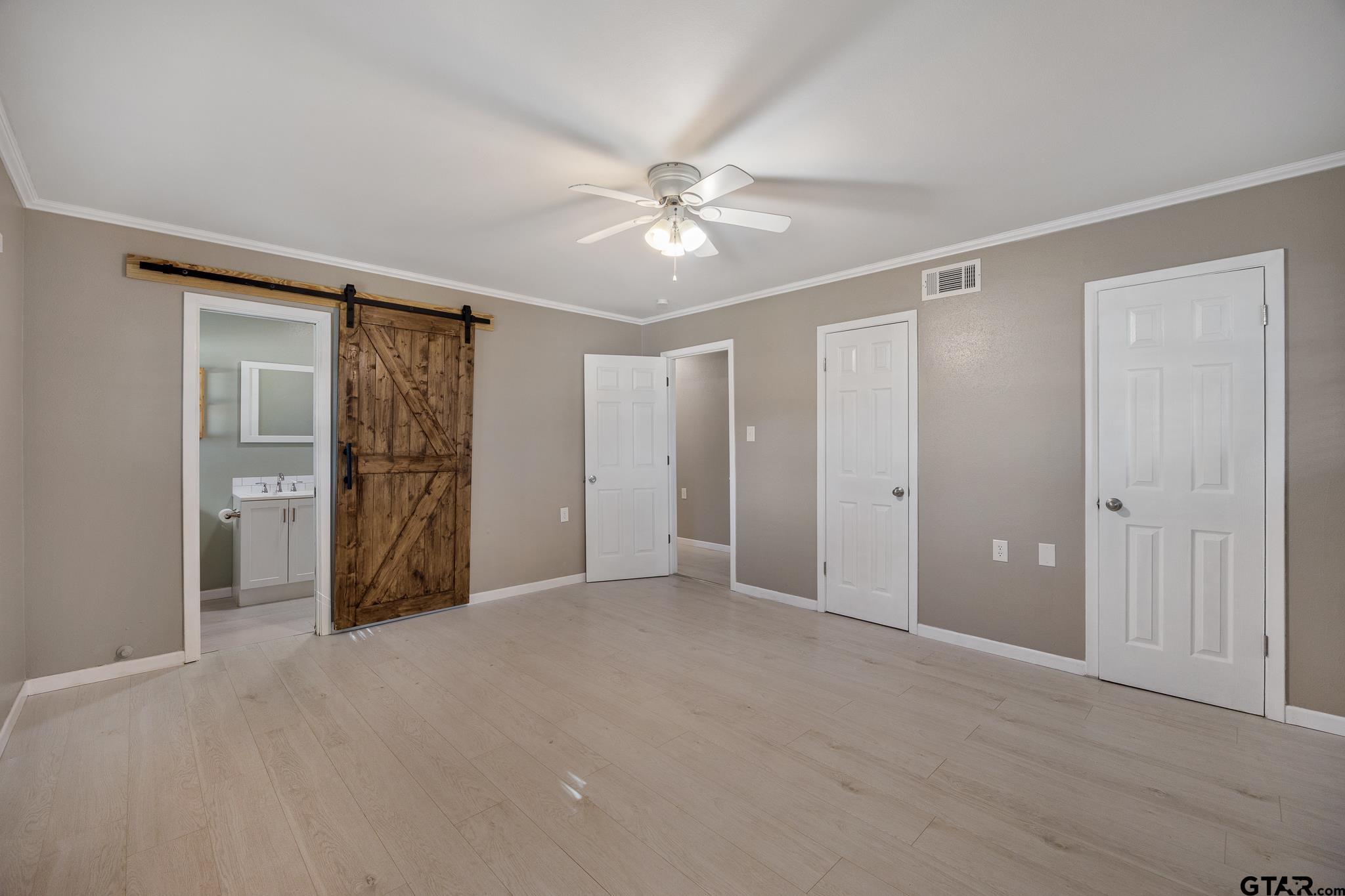291 East Main Street Van, TX 75790 - Photo 25 of 43 a view of a big room with closet and a chandelier fan
