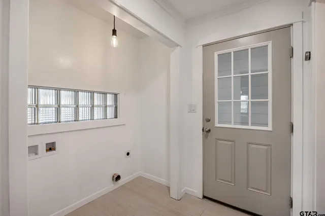 a view of an empty room with a window