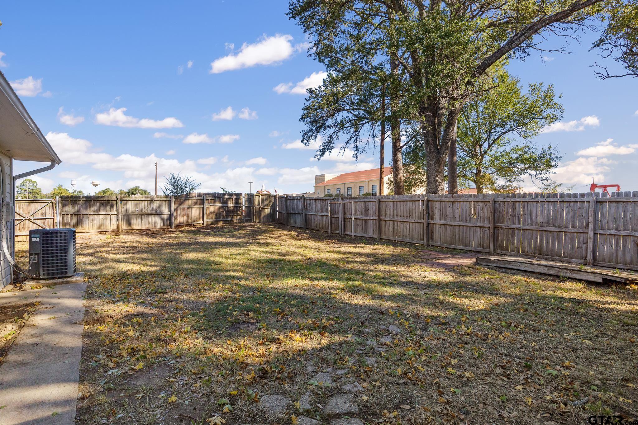 291 East Main Street Van, TX 75790 - Photo 28 of 37 a view of a backyard with wooden fence