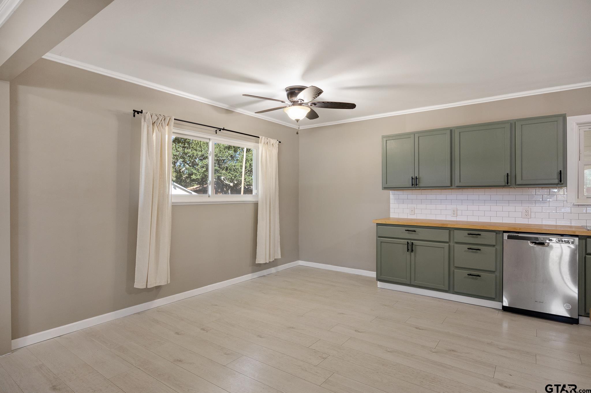 291 East Main Street Van, TX 75790 - Photo 5 of 37 a kitchen with a refrigerator and ceiling fan