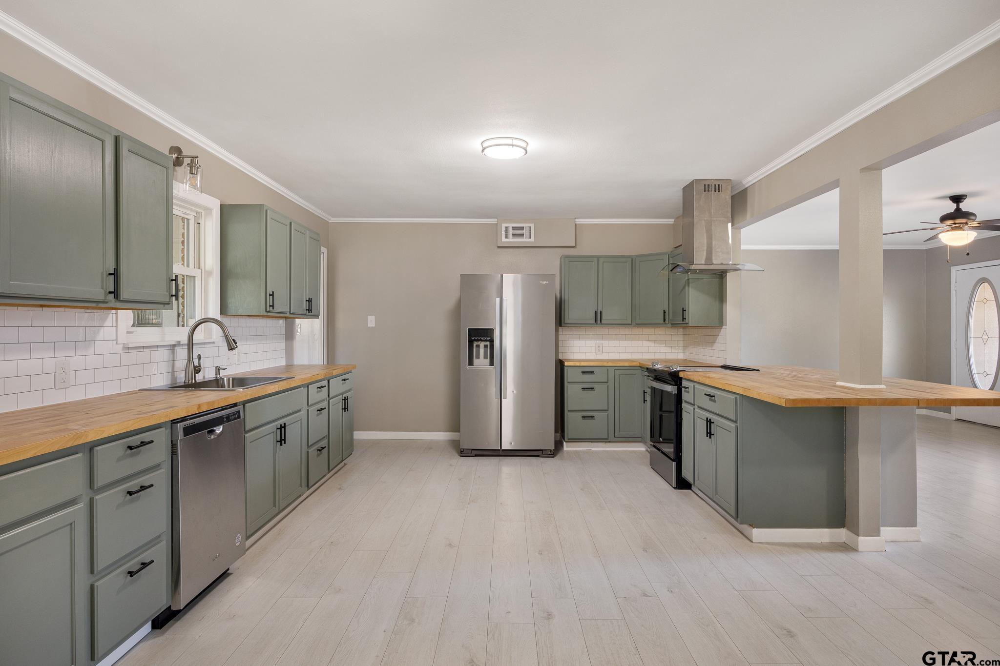 291 East Main Street Van, TX 75790 - Photo 8 of 37 a large kitchen with cabinets and stainless steel appliances