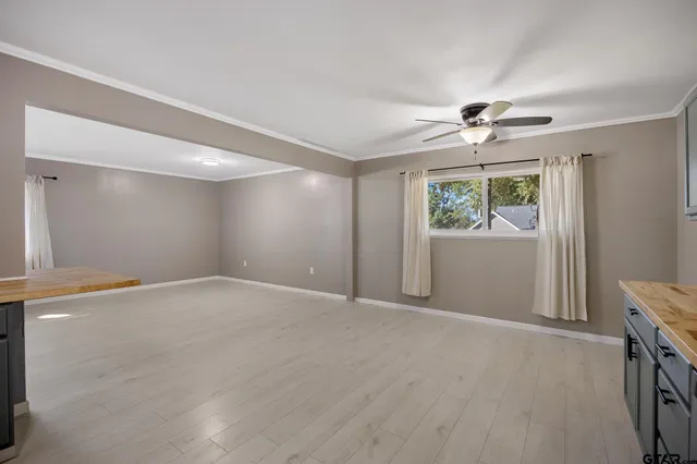 a view of an empty room with a window