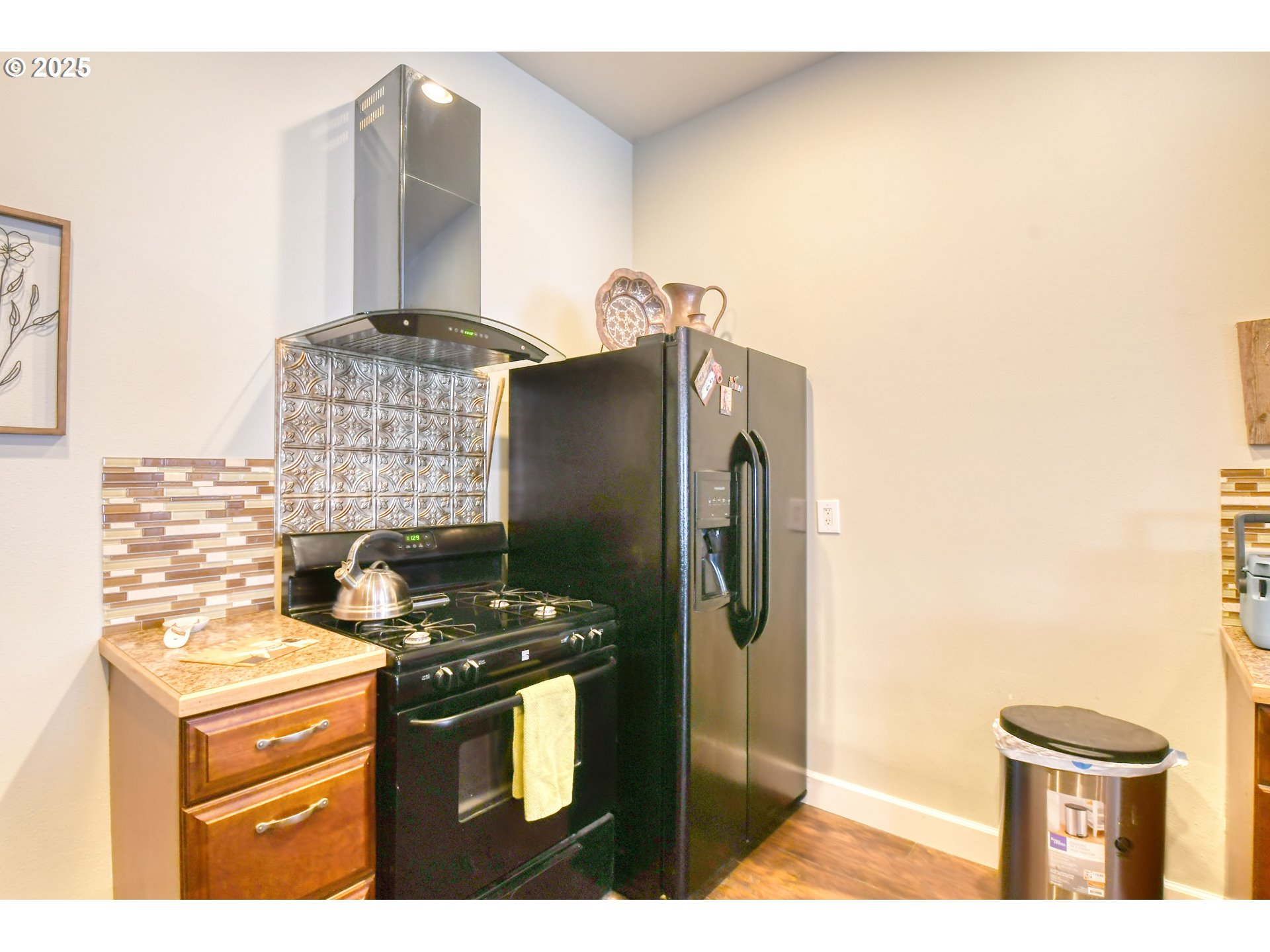 330 2nd Street Athena, OR 97813 - Photo 19 of 30 a kitchen with stainless steel appliances granite countertop a stove and a refrigerator