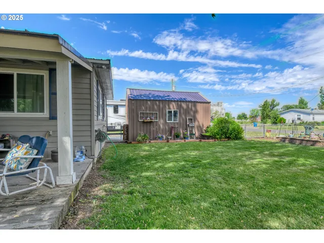 a view of a patio with a yard