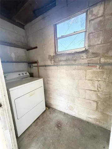 a bathroom with a granite countertop sink a mirror and a shower