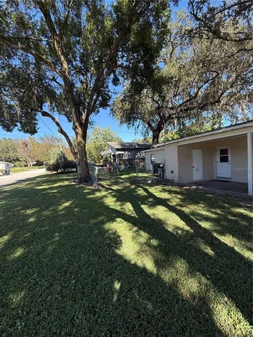 a backyard of a house with lots of green space
