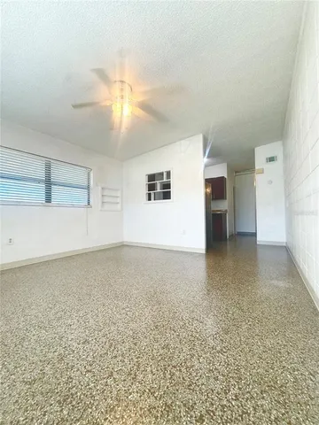 a view of an empty room with a window