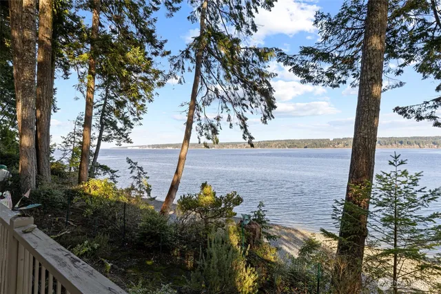 a view of a lake with outdoor seating