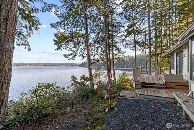 a view of a pathway of a building with large trees