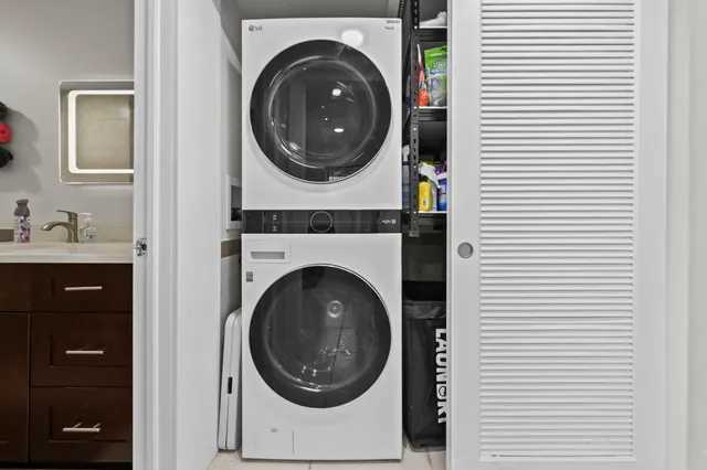 a view of a hallway with washer and dryer