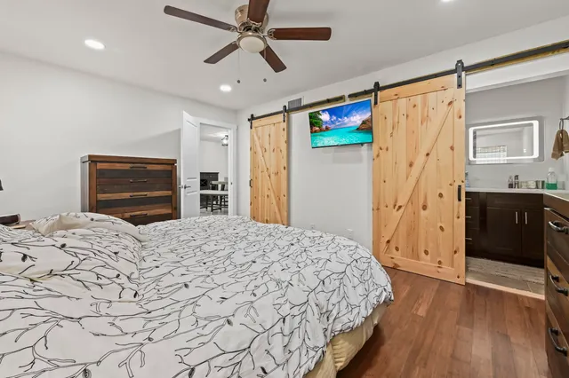 a bedroom with a bed and a dresser