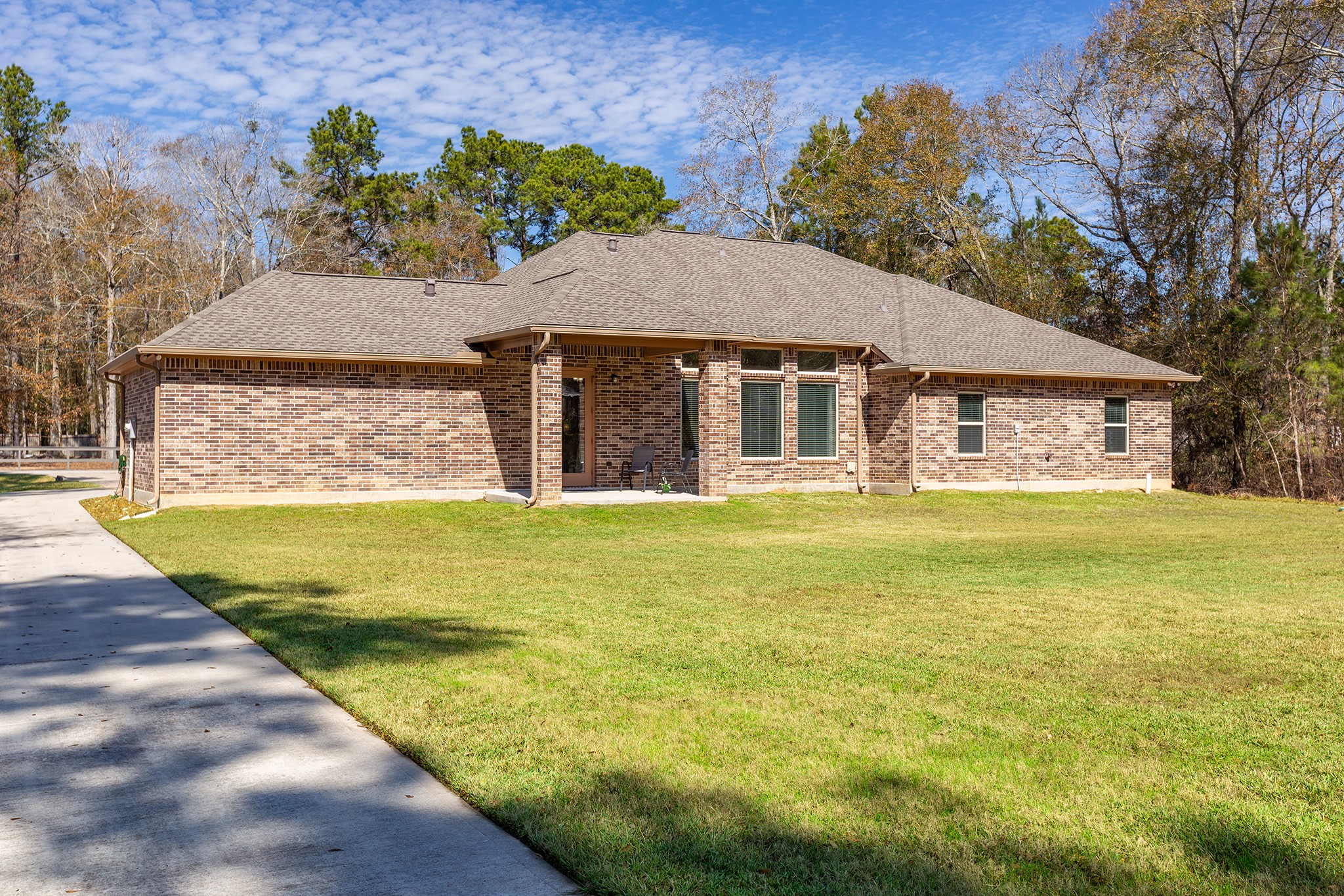 27688 Rio Blanco Drive Splendora, TX 77372 - Photo 42 of 50 a view of a house with a swimming pool