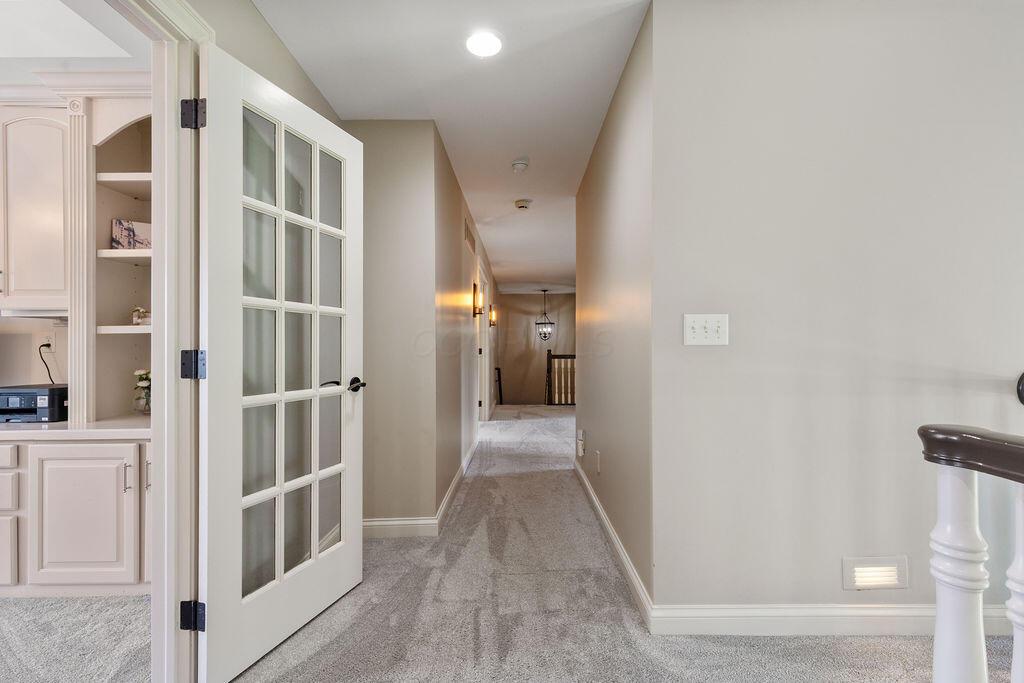 2570 Jewett Road Powell, OH 43065 - Photo 40 of 104 • New carpet runner ~ 2025 • Grey painted walls • Art niche