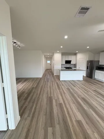 a view of kitchen with sink microwave and stove