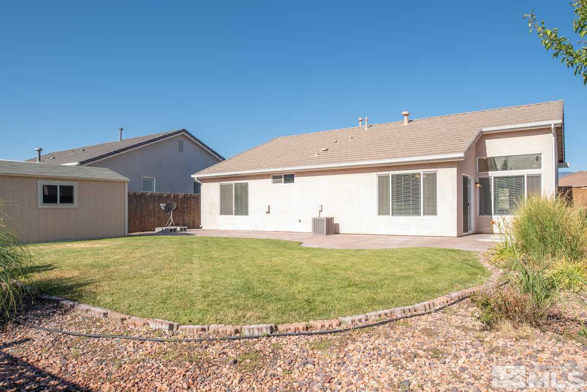 10340 Rosemount Drive Reno, NV 89521 - Photo 17 of 28 a view of a house with a backyard