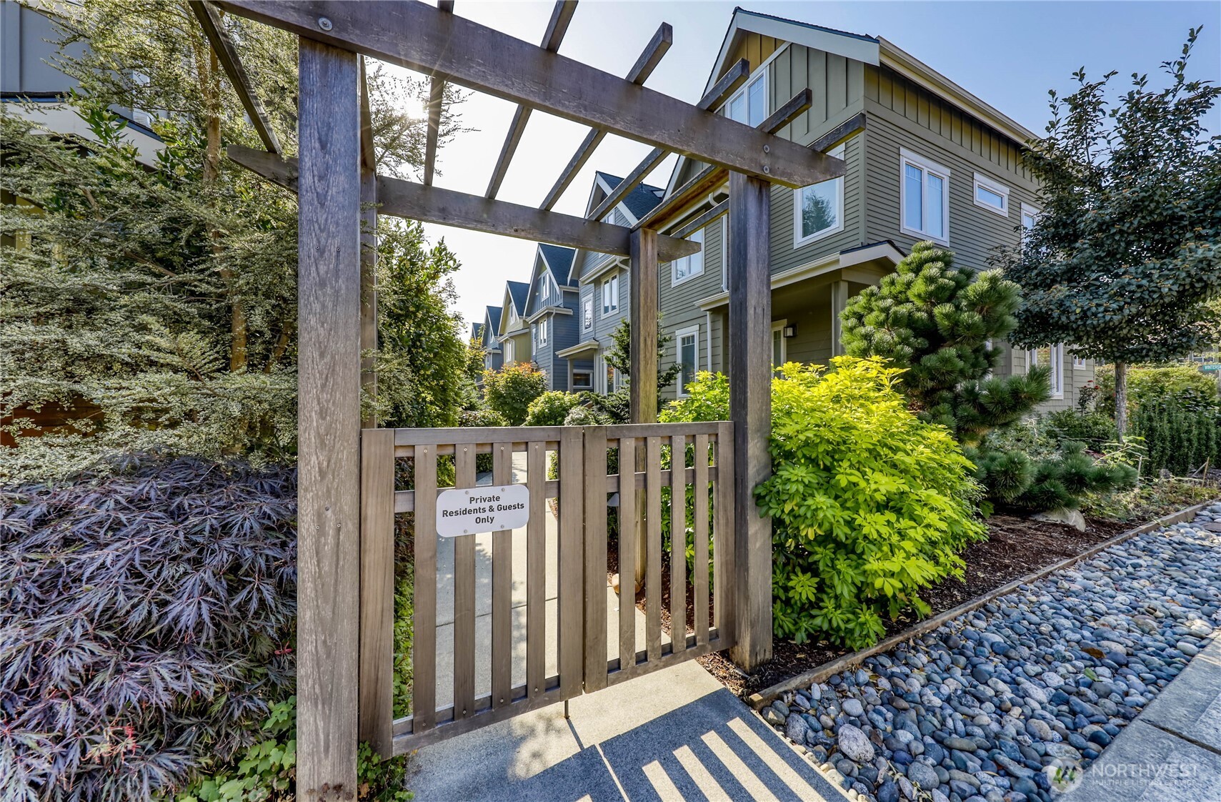 690 Wintersweet Road Northeast Bainbridge Island, WA 98110 - Photo 2 of 23 a view of a house with a street