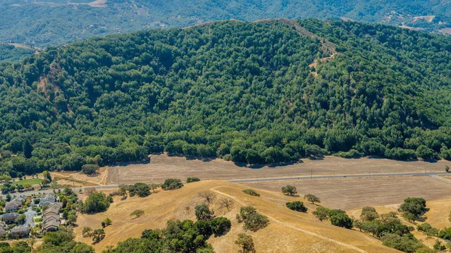an aerial view of a house with a garden