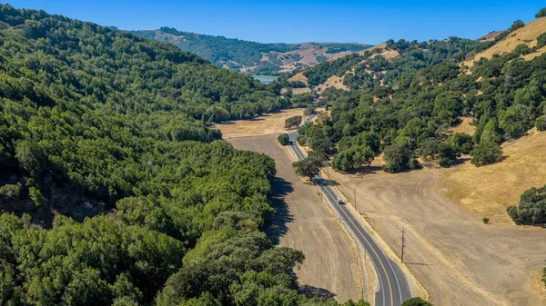 a view of a yard with a mountain
