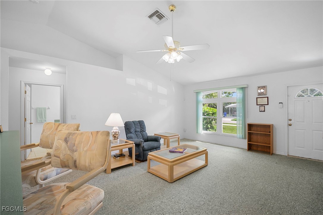 2932 Holly Road Fort Myers, FL 33901 - Photo 20 of 39 a living room with furniture and a window
