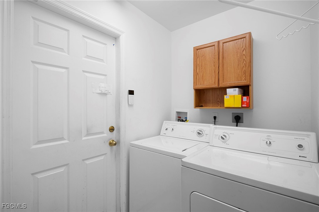 2932 Holly Road Fort Myers, FL 33901 - Photo 35 of 39 a utility room with dryer and washer