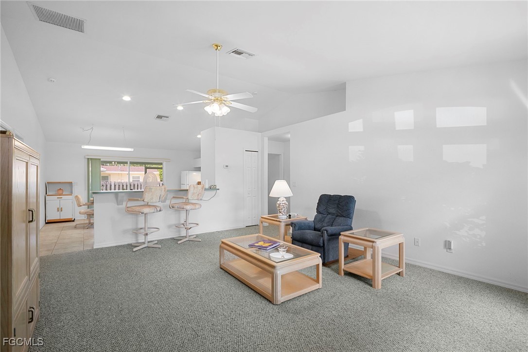 2932 Holly Road Fort Myers, FL 33901 - Photo 4 of 39 a living room with furniture and a table