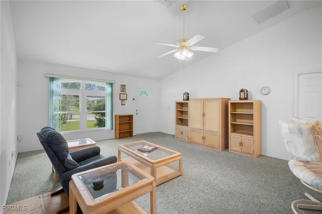 a living room with furniture and a window