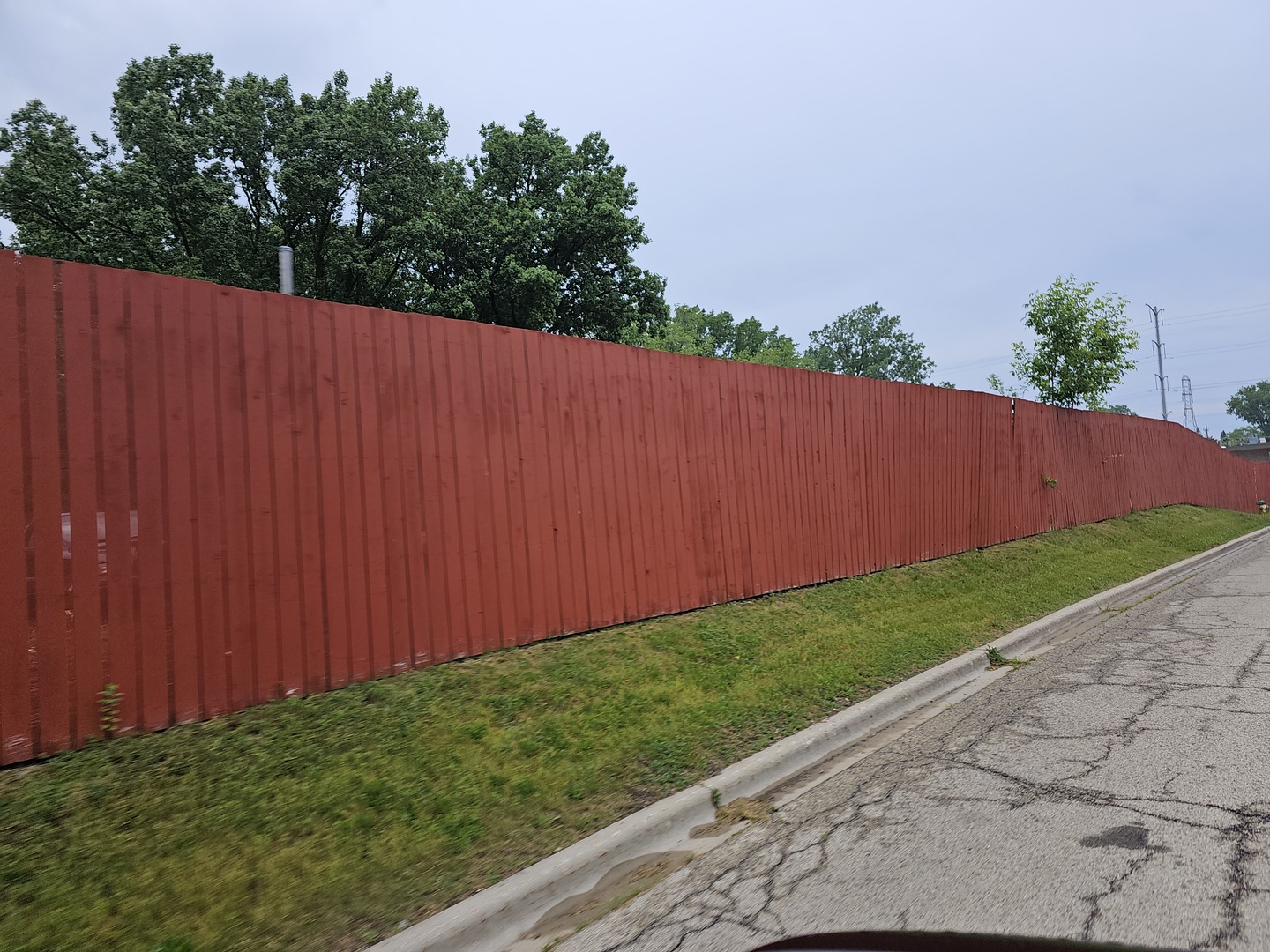 603 North Austin Avenue Waukegan, IL 60085 - Photo 2 of 6 a view of a backyard with potted plants and wooden fence