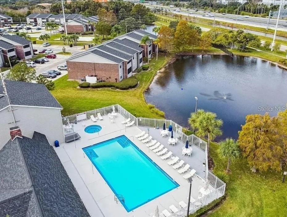 an aerial view of a house with a swimming pool yard and outdoor seating