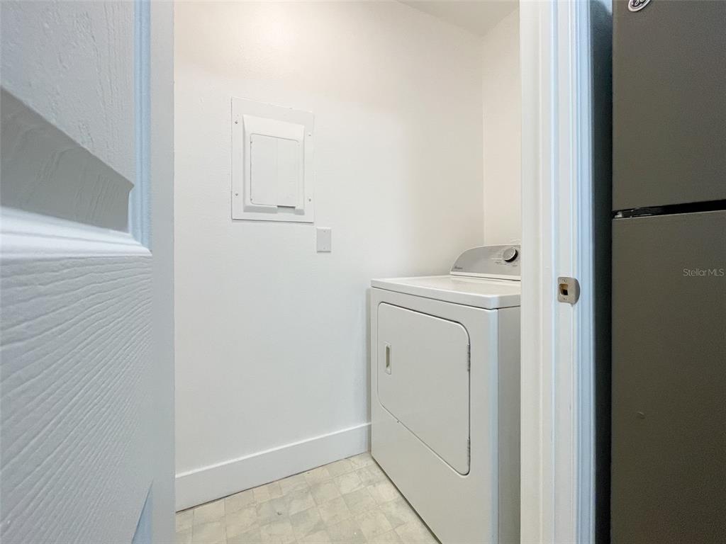 1400 Gandy Boulevard North, Unit 412 St. Petersburg, FL 33702 - Photo 12 of 44 a utility room with dryer and washer