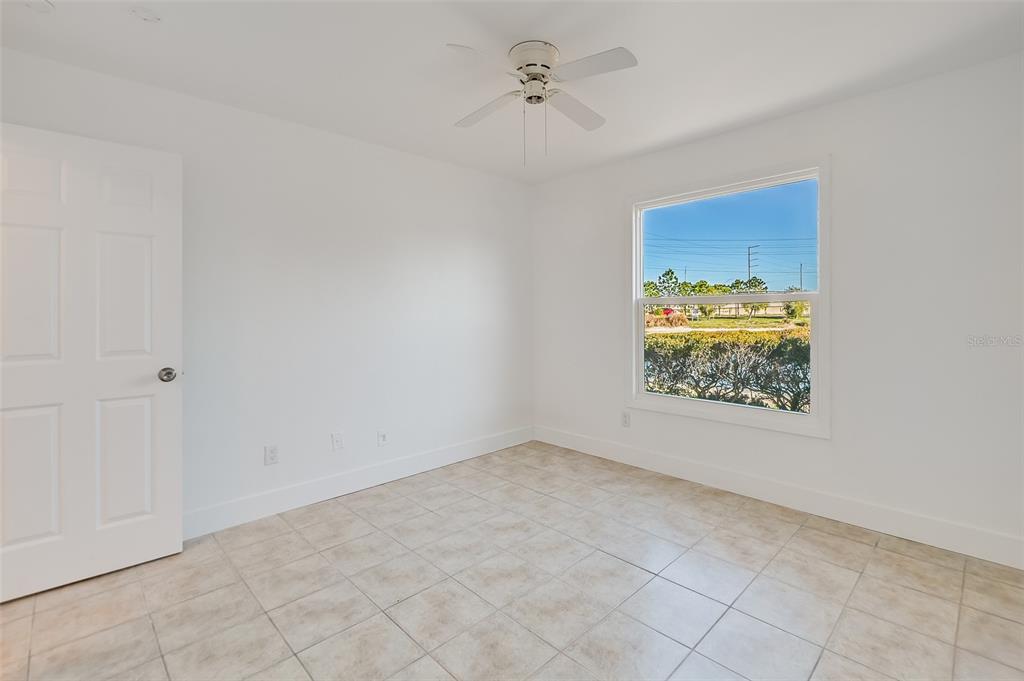 1400 Gandy Boulevard North, Unit 412 St. Petersburg, FL 33702 - Photo 26 of 44 an empty room with windows