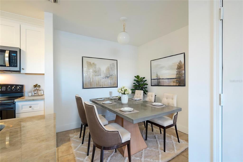 1400 Gandy Boulevard North, Unit 412 St. Petersburg, FL 33702 - Photo 3 of 44 a dining room with furniture and window