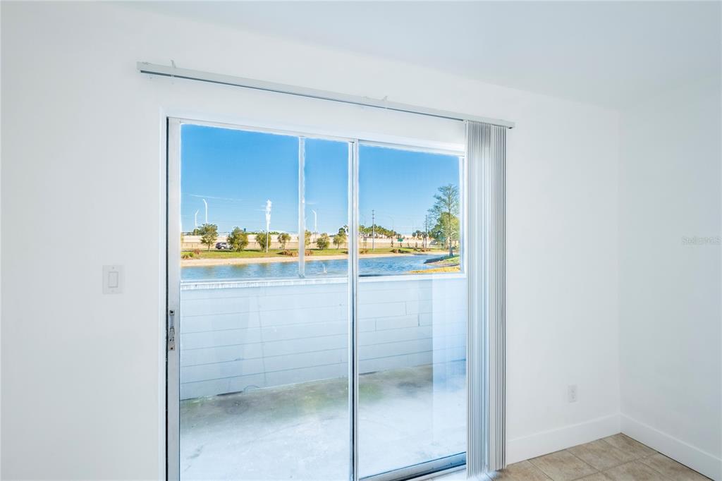 1400 Gandy Boulevard North, Unit 412 St. Petersburg, FL 33702 - Photo 32 of 44 a room with a wooden floor and cabinets