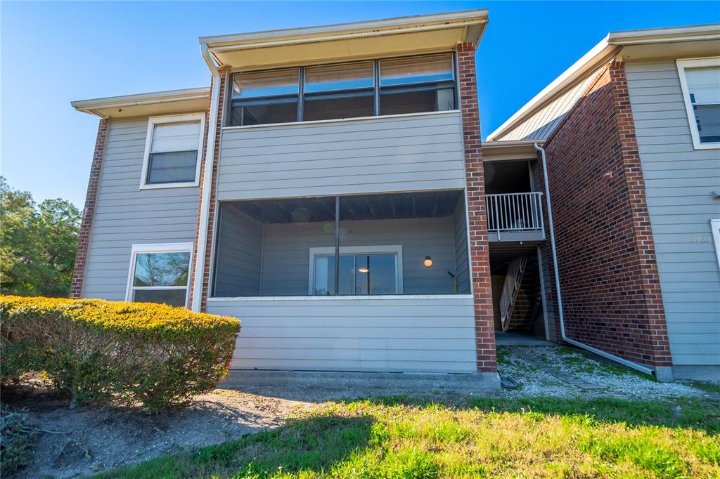 1400 Gandy Boulevard North, Unit 412 St. Petersburg, FL 33702 - Photo 37 of 44 a front view of a house with a yard