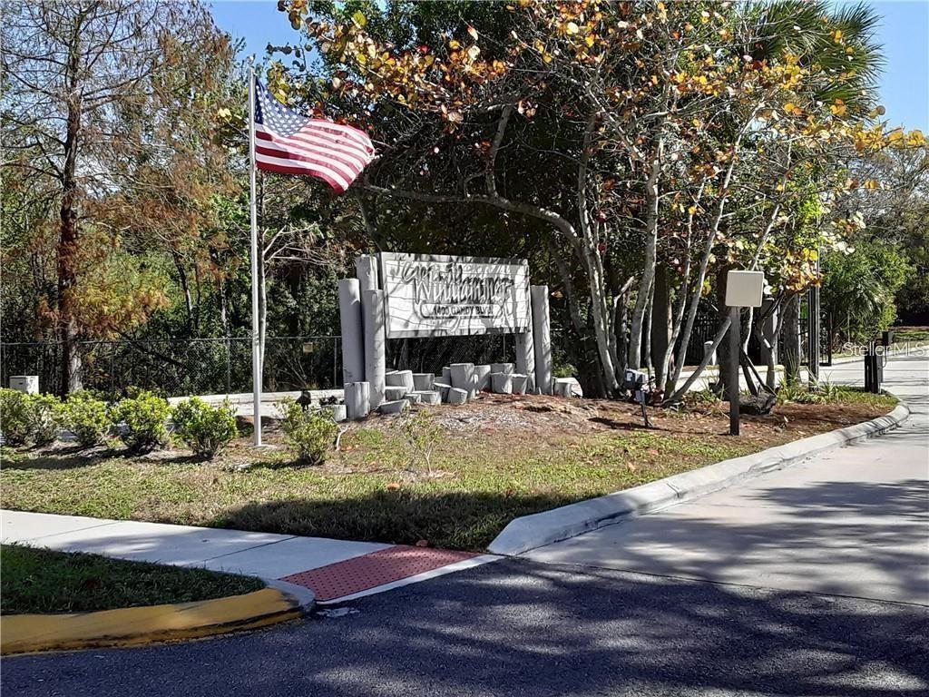 1400 Gandy Boulevard North, Unit 412 St. Petersburg, FL 33702 - Photo 41 of 44 a view of a house with swimming pool and sitting area