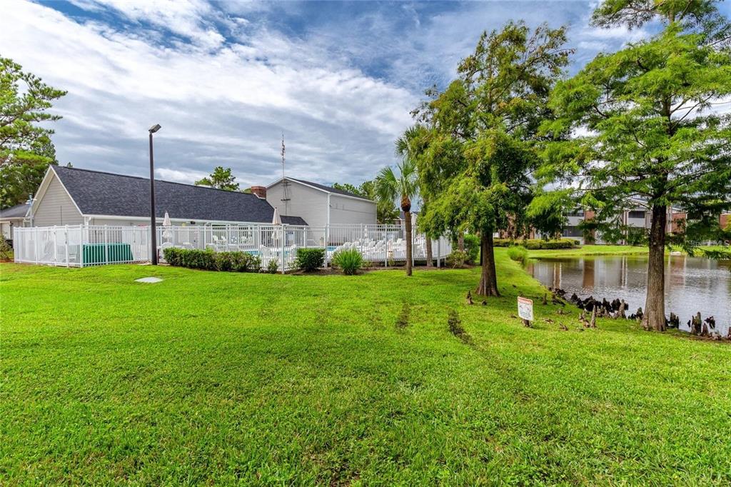 1400 Gandy Boulevard North, Unit 412 St. Petersburg, FL 33702 - Photo 43 of 44 a view of backyard with house and green space