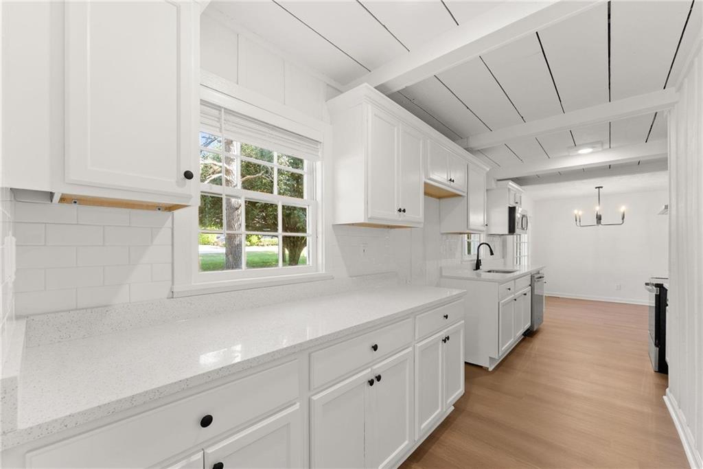 225 Northview Drive Commerce, GA 30529 - Photo 12 of 39 a large white kitchen with a large window