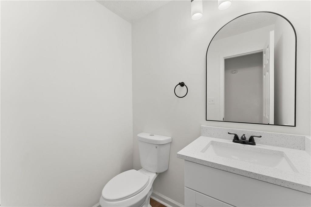 225 Northview Drive Commerce, GA 30529 - Photo 15 of 39 a bathroom with a sink a toilet and a mirror