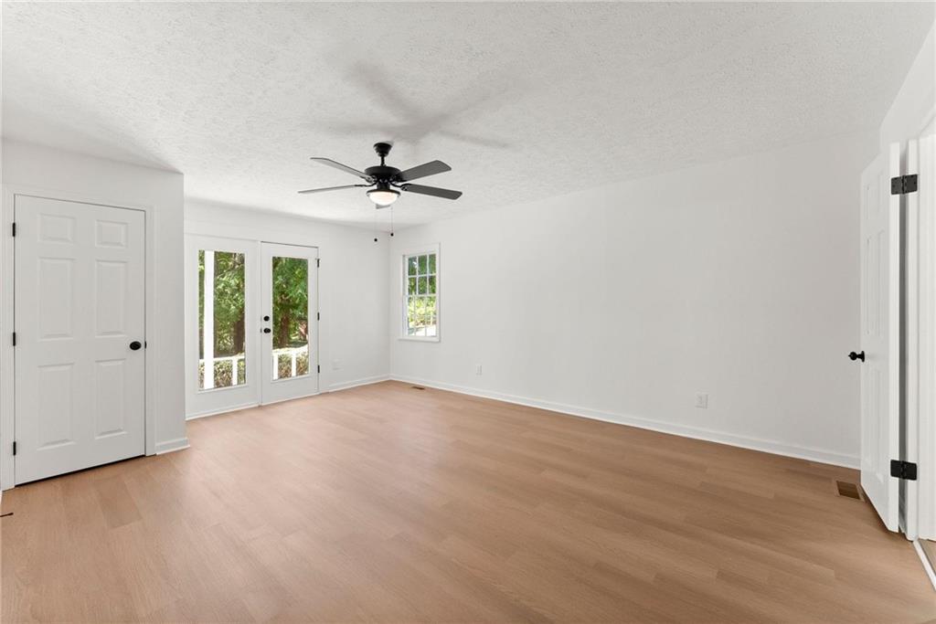 225 Northview Drive Commerce, GA 30529 - Photo 16 of 39 wooden floor in an empty room with a window