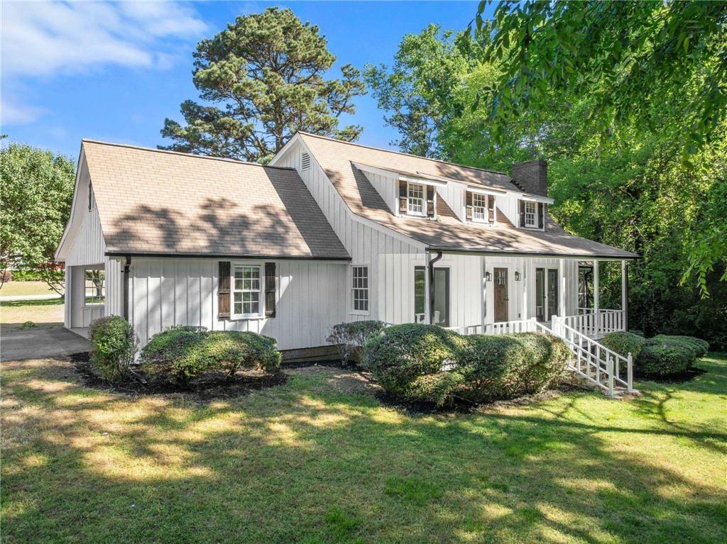 225 Northview Drive Commerce, GA 30529 - Photo 2 of 39 a front view of a house with a yard and potted plants